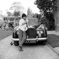 Keith Richards photographed next to a Bentley 'Blue Lena' in West Sussex, 1966.