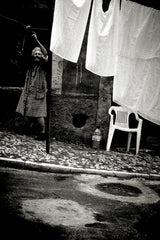 Woman hanging up laundry, Lisbon