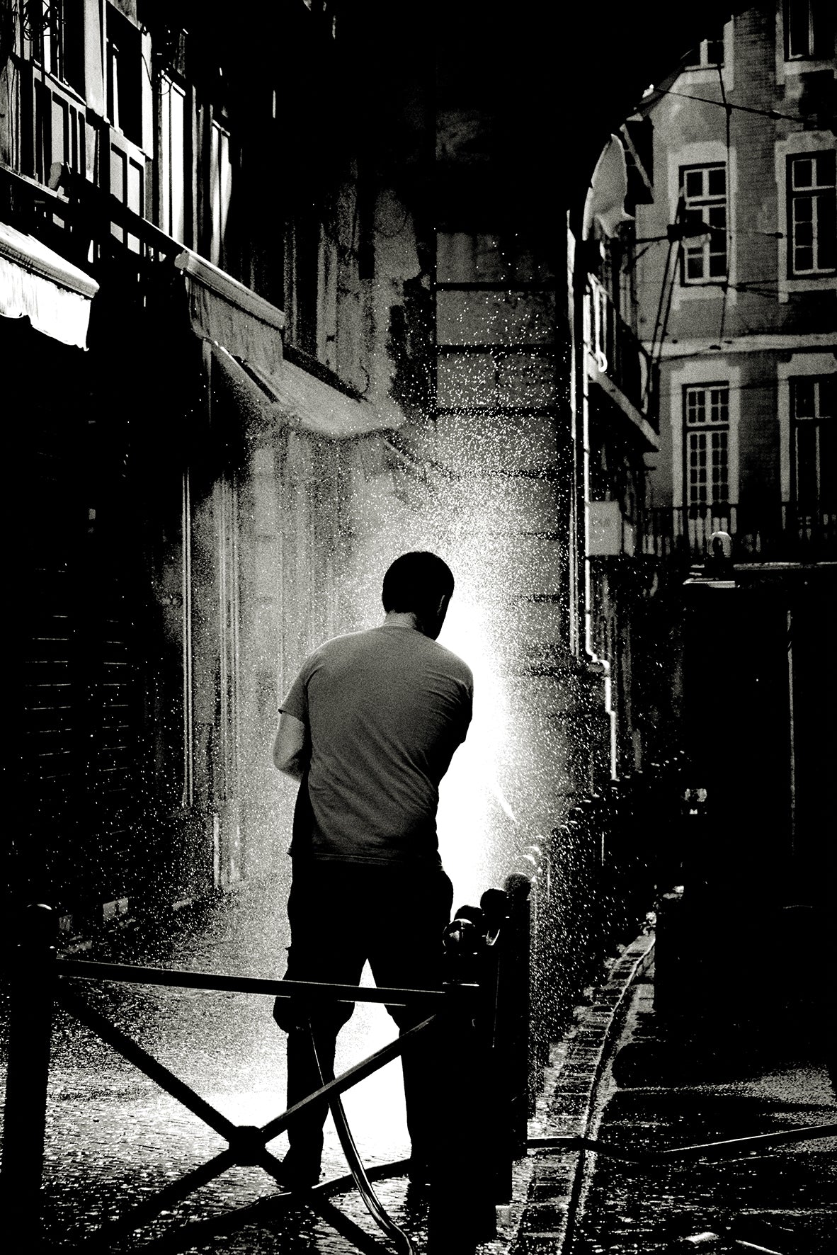 Street cleaner, Lisbon by Andreas H. Bitesnich, limited edition photography