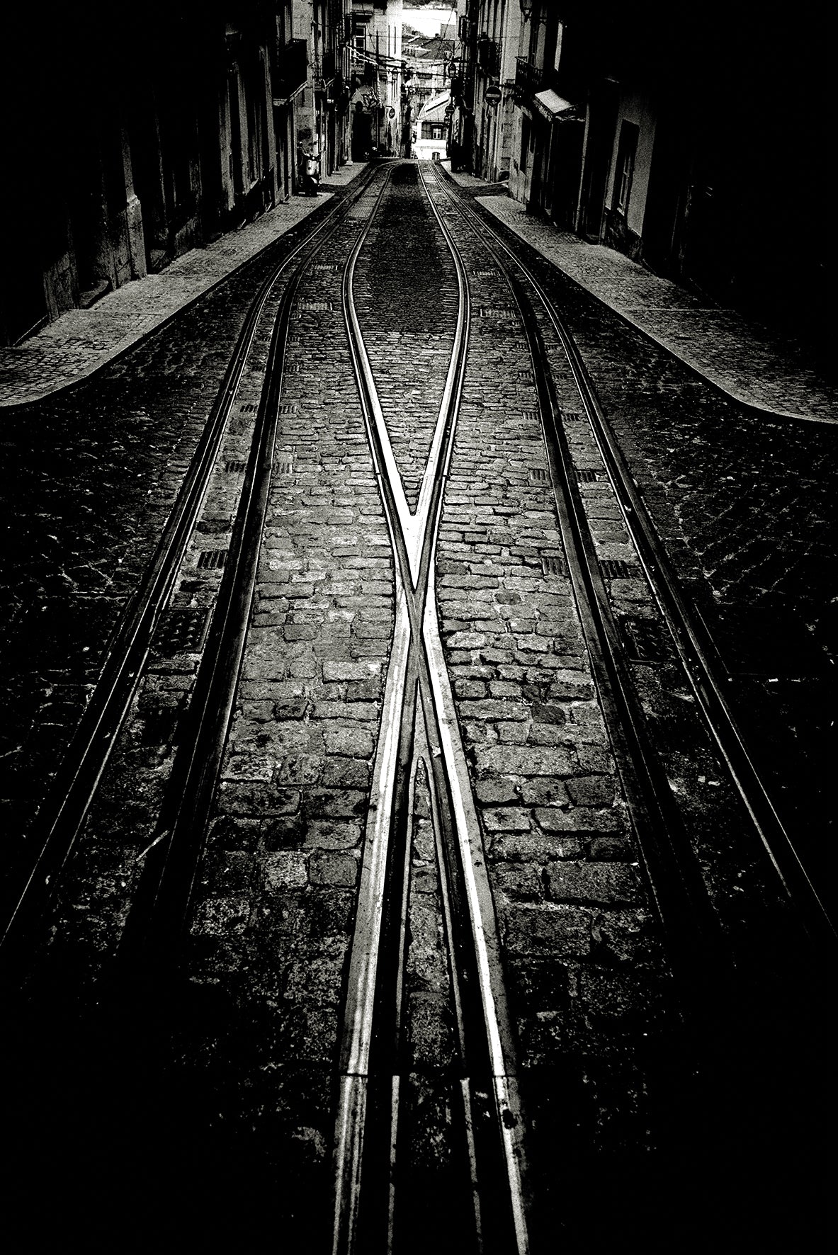 Crossing tram tracks, Lisbon