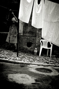 Woman hanging up laundry, Lisbon