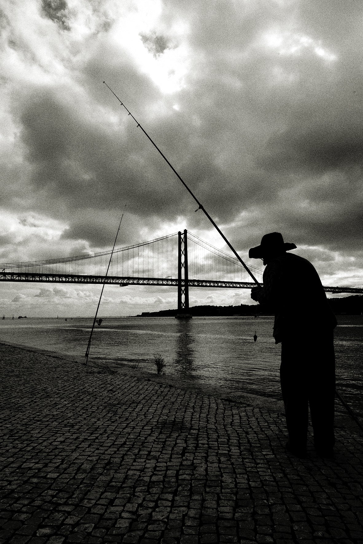 Man fishing, Lisbon by Andreas H. Bitesnich, limited edition photography