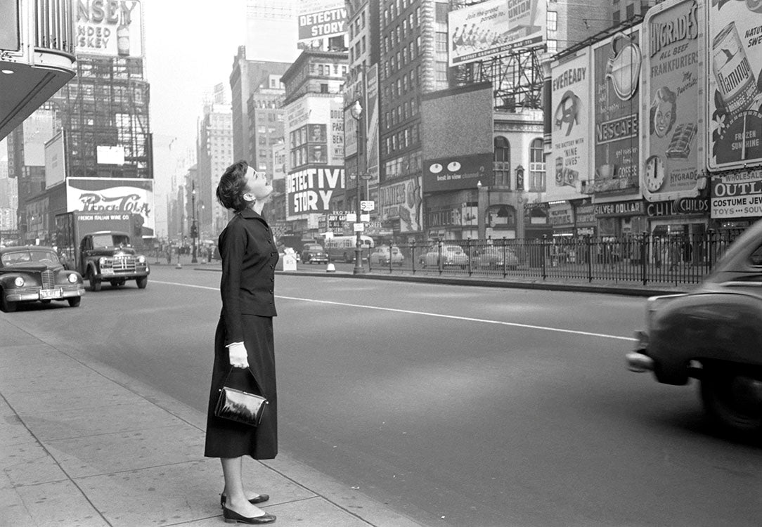 Audrey Hepburn standing in Times Square, whilst starring in 'Gigi' 1951. by Lawrence Fried, limited edition photography