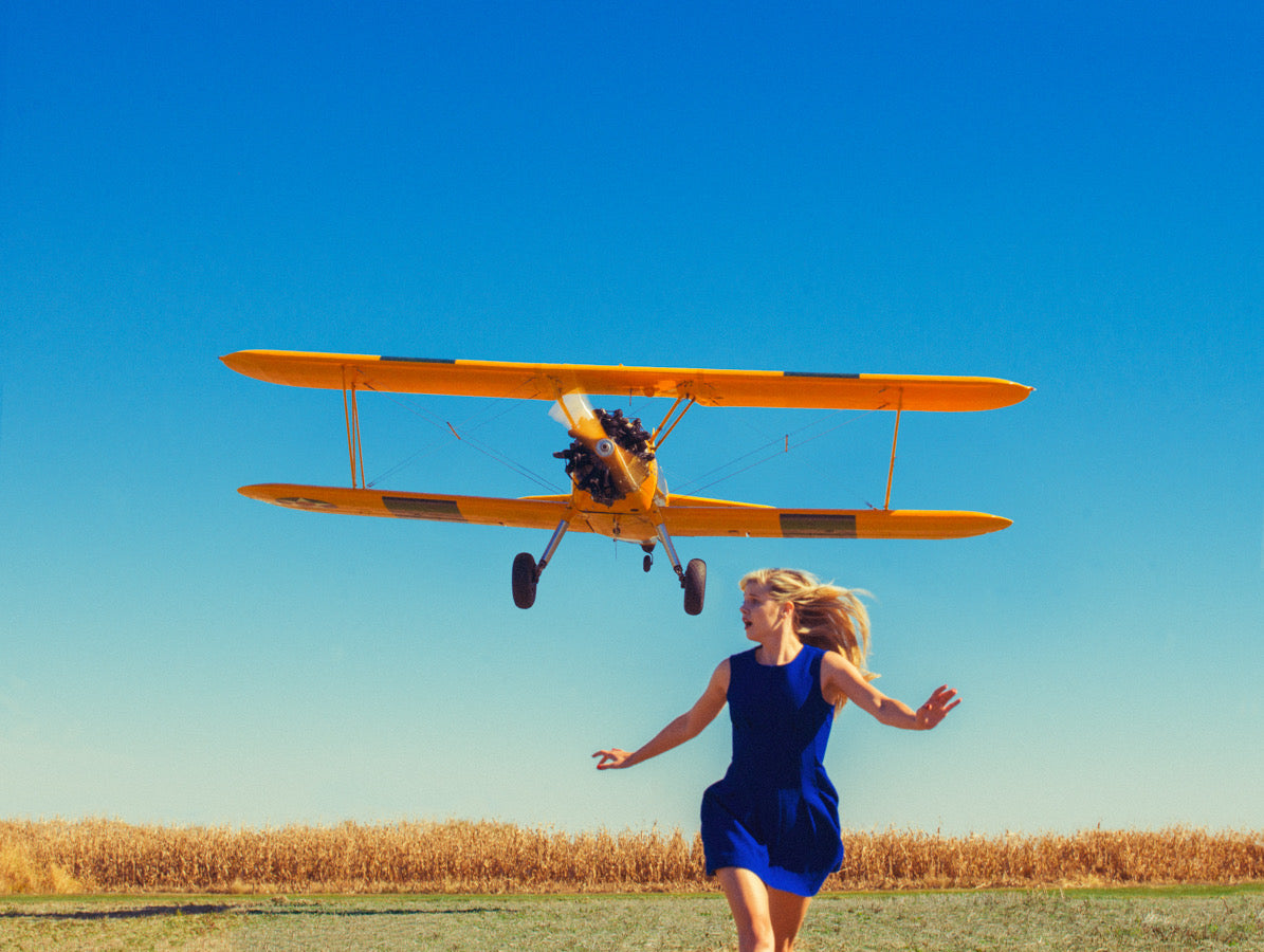 Girl Running from Plane by Tyler Shields, limited edition photography
